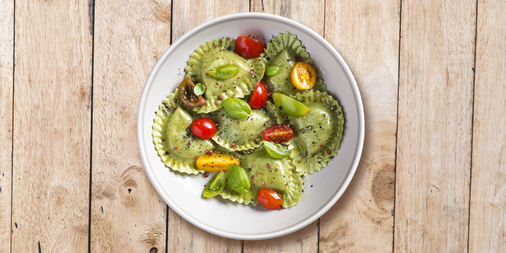 Broccoli, spinach and olive Girasoli with cherry tomatoes, basil, black and pink pepper