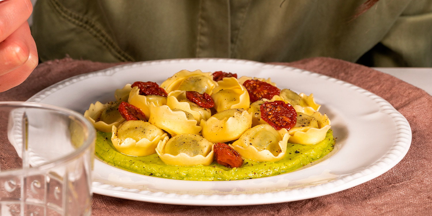 Tortellini filled Ricotta and Spinach with avocado cream and cherry tomatoes confit