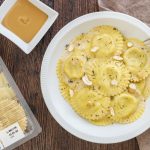 Ravioli Burrata e Scorza di Limone di Sicilia con crema di anacardi, anacardi tostati e timo fresco